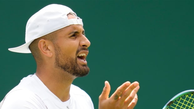 Australia’s Nick Kyrgios complains about an umpire decision during the singles tennis match against Britain’s Paul Jubb on day two of the Wimbledon tennis championships in London, Tuesday, June 28, 2022.