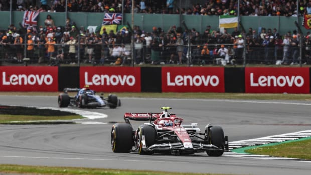 Two cars race in the British Grand Prix.
